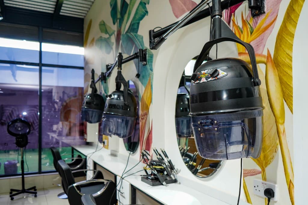Lintons hair salon styling stations with tropical mural